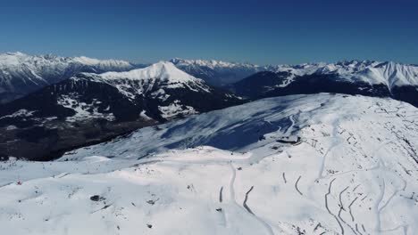 Mountain-ski-resort-in-Alps,-aerial