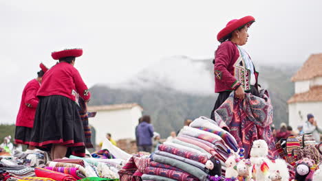 Local-Quechua-women-showcase-artisan-crafts-and-wares-on-cloudy-day-in-mountains