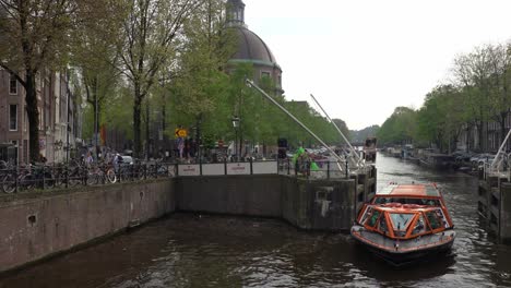 Tourist-boat-cruising-in-canal