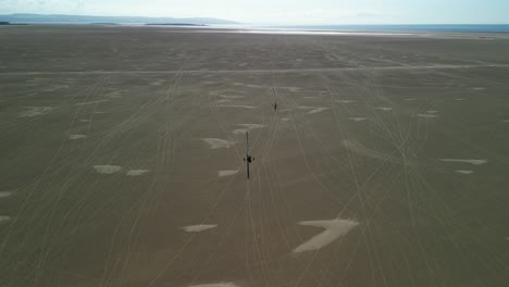Sandyacht-in-action-on-a-sunny-afternoon-at-Hoylake-Beachfront---aerial-drone,-Wirral,-UK