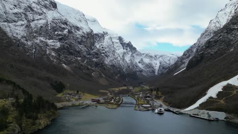 Gudvangen-town-Norway-during-winter-in-the-morning-fjords-drone-shot