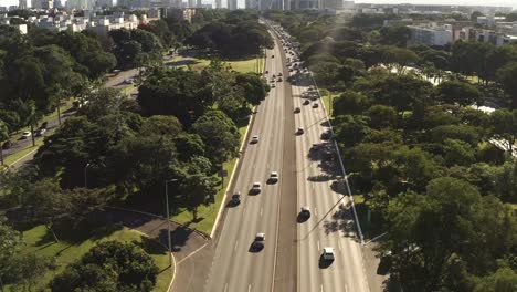 City-sunset,-downtown-traffic-highways,-people-of-Brasilia-commute,-aerial