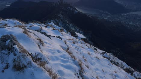 Tilt-Up-Shot-To-Reveal-Golden-Hour-Sunset-Sky-Over-Lecco-Alps-Landscape