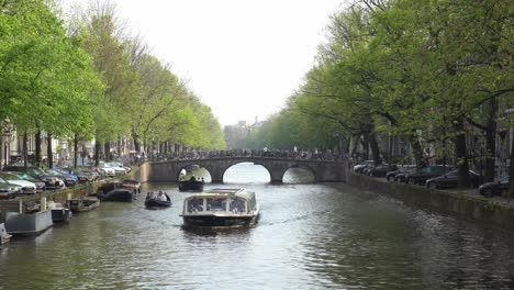 Tourist-boat-cruising-in-canal