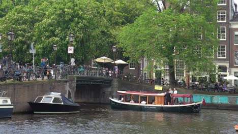 Tourist-boat-cruising-in-canal