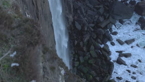 Slow-motion-shot-of-the-beautiful-Mealt-Falls-falling-onto-the-basalt-rocks