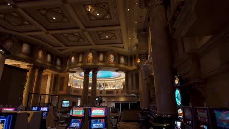 POV-walking-through-Caesars-Palace-Casino-interior-with-slow-machines-and-people-gambling