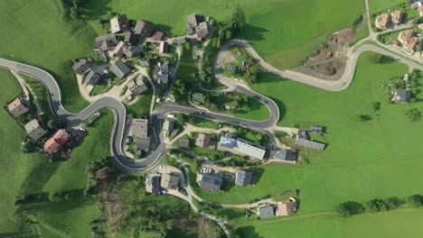 Aerial-overhead-footage-captures-winding-roads-of-La-Val-village-in-Italian-Dolomites