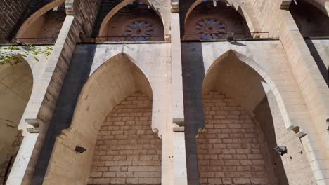 Columns,-arches-and-looking-up-in-Son-Servera's-never-finished-church-by-Joan-Rubio-Esglesia-Nova,-architectural-wonder,-Mallorca,-Spain