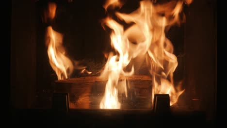 fire-burns-logs-in-fireplace,-beautiful-flames