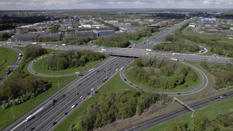 Slow-ascending-aerial-showing-large-Dutch-transit-roundabout-Hoevelaken-intersection-near-Amersfoort