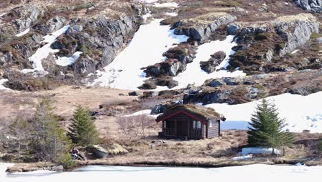 Isolated-Wooden-Cabin-By-The-Shore-Of-Palvatnet-Lake-In-Norway