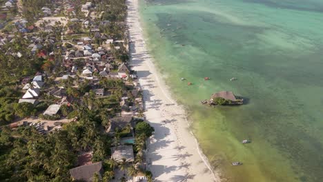 Unique-ocean-rock-restaurant-aerial-view-looking-down-over-Michamvi-Pingwe-beach-lush-Zanzibar-shore