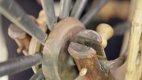 Close-up-detail:-Vintage-Nordic-treadle-spinning-wheel-hub-turning