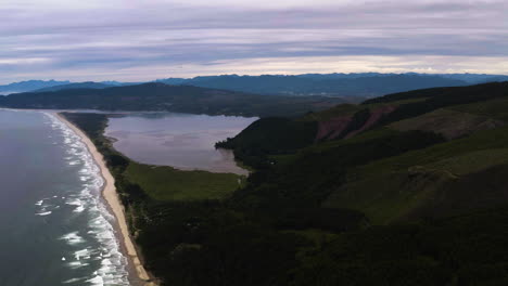 Panoramic-aerial-establishing-overview-of-Cape-Lookout-and-Netarts-Bay,-Oregon-Coast