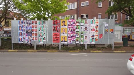 Fila-De-Pancartas-Fotográficas-De-Candidatos-Y-Partidos-Políticos-Para-Las-Elecciones-Belgas-Del-9-De-Junio-De-2024---Woluwe-saint-pierre,-Bruselas,-Bélgica.