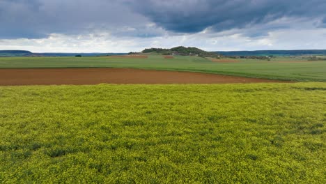 Graphic-colinne-in-the-middle-of-a-landscape-in-the-French-countryside,-storm-clouds-in-the-background