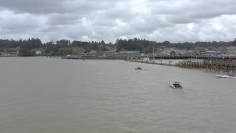 2024-UIM-World-Jet-Boat-River-Racing-Championship-in-Bandon-Oregon,-slow-drone-over-waiting-boats