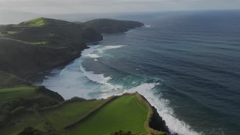 Aerial-shot,-drone-point-of-view-rocky-coastline,-Atlantic-Ocean-coastline-of-Island-of-Sao-Miguel,-Azores,-Portugal