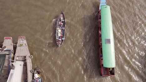 Top-down-view-of-a-merchant-boat-at-the-Cai-Rang-floating-market-on-Can-Tho-river,-Vietnam,-Asia
