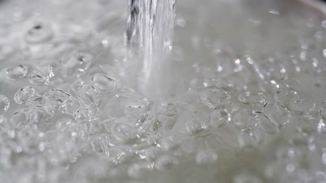 Close-up-macro-of-a-running-dripping-tap