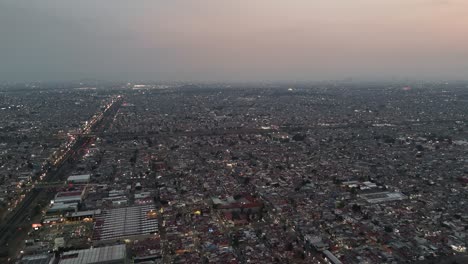 Aerial-view-as-dusk-descends-over-Mexico's-most-populous-municipality,-Ecatepec