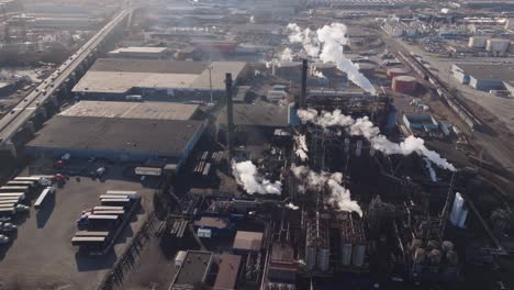 Industrial-complex-with-smokestacks-in-hamilton,-ontario,-during-daylight,-aerial-view