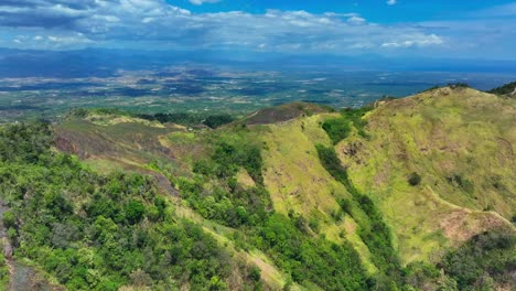 Green-Mountains-with-path-on-peak-on-Mindanao-Island,-Philippines-in-summer
