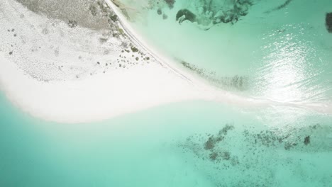 Cayo-de-agua-in-los-roques-with-turquoise-waters-and-white-sandy-beach,-aerial-view