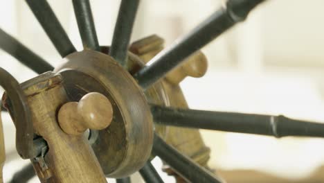 Treadle-arm-turns-hub-and-spokes-of-traditional-Nordic-spinning-wheel