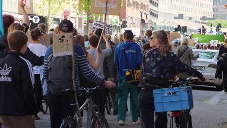 Environmental-Activists-Marching-On-Street-During-Climate-Protest-In-Stockholm,-Sweden,-static-shot