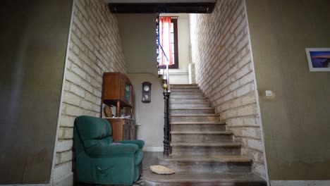 Slow-establishing-shot-of-a-small-staircase-within-an-retro-villa-in-Pignan