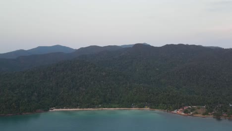 Aerial-High-Angle-View-Of-Lonely-Beach-At-Koh-Chang-With-Forest-Hill-Landscape-In-Background