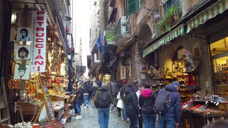 People-Walking-Along-The-Street-With-Local-Shops-At-Quartieri-Spagnoli-In-Naples,-Italy