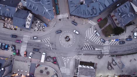 Ascending-overhead-view-of-a-traffic-circle-in-the-town-of-Benasque-in-the-province-of-Huesca,-Aragon,-Spain