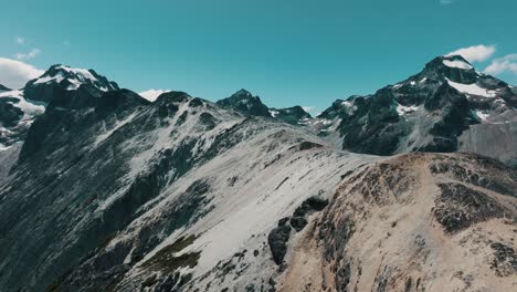 Mountains-Surrounding-Laguna-Esmeralda-In-Ushuaia,-Tierra-del-Fuego-Province,-Argentina---Drone-Shot