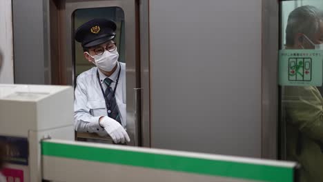 Commuters-moving-through-Shibuya-Station-during-rush-hour,-Shibuya-District,-Tokyo,-Japan