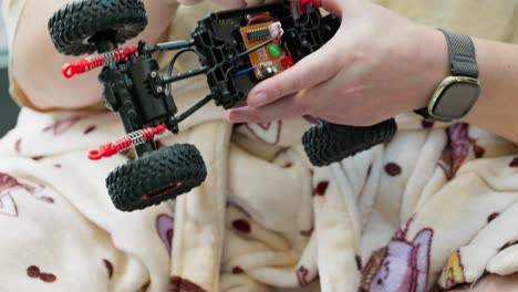 Mother-and-son-on-Christmas-morning-building-a-new-toy-car