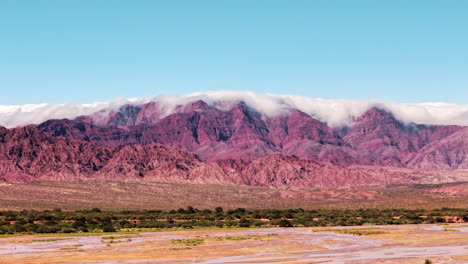 Drone-hyperlapse-captures-the-mountains-of-Cafayate,-Salta,-Argentina,-as-they-are-engulfed-by-swirling-clouds