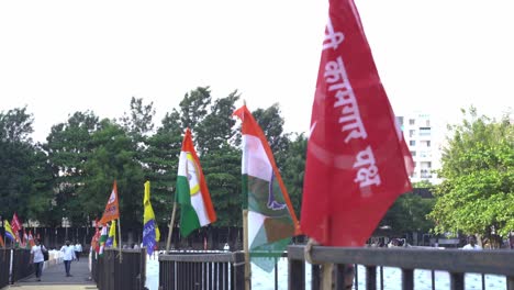 Political-flags-during-Lok-Sabha-election-campaign-by-Uddhav-Thackeray-and-Sharad-Pawar-at-college-ground-in-Warje