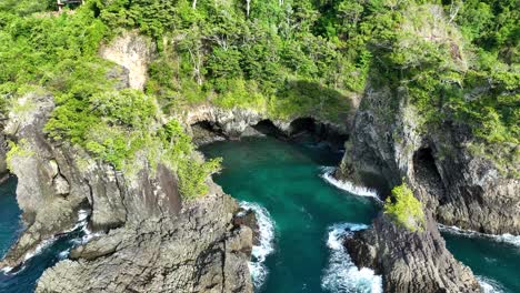 West-coast,-Pulau-Weh,-island-of-dramatic-coastal-rock-formations,-aerial