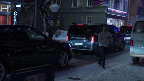 Davos-high-street-at-night-time-backed-up-with-traffic-and-pedestrians-during-the-World-Economic-Forum