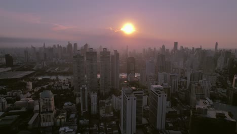 Captivating-sunrise-over-a-densely-packed-Bangkok-skyline-with-varied-modern-and-traditional-architecture,-Thailand