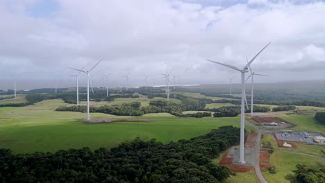 Renewable-energy-wind-farm-with-spinning-propellers-aerial-view-in-Tasmania,-Australia