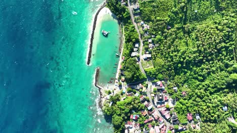 Panning-aerial,-coastline-scenery,-secluded-destination,-vertical-view