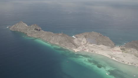 Gran-roque-with-clear-turquoise-waters-and-full-island-panorama,-aerial-view