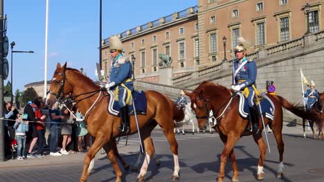 Parade-of-National-Guard-on-horses-by-Stockholm-Palace,-slow-motion