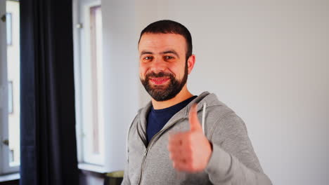 Happy-Portrait-Of-A-Middle-Eastern-Man-With-Thumbs-Up-Hand-Gesture