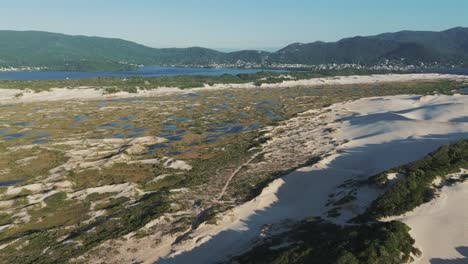 A-landscape-of-the-Joaquina-sand-dunes-in-Florianopolis-portrays-a-magical-setting-on-Brazil's-most-renowned-island