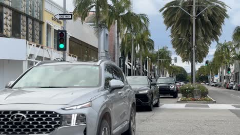 Luxury-cars-drive-down-Rodeo-Drive-in-Beverly-Hills